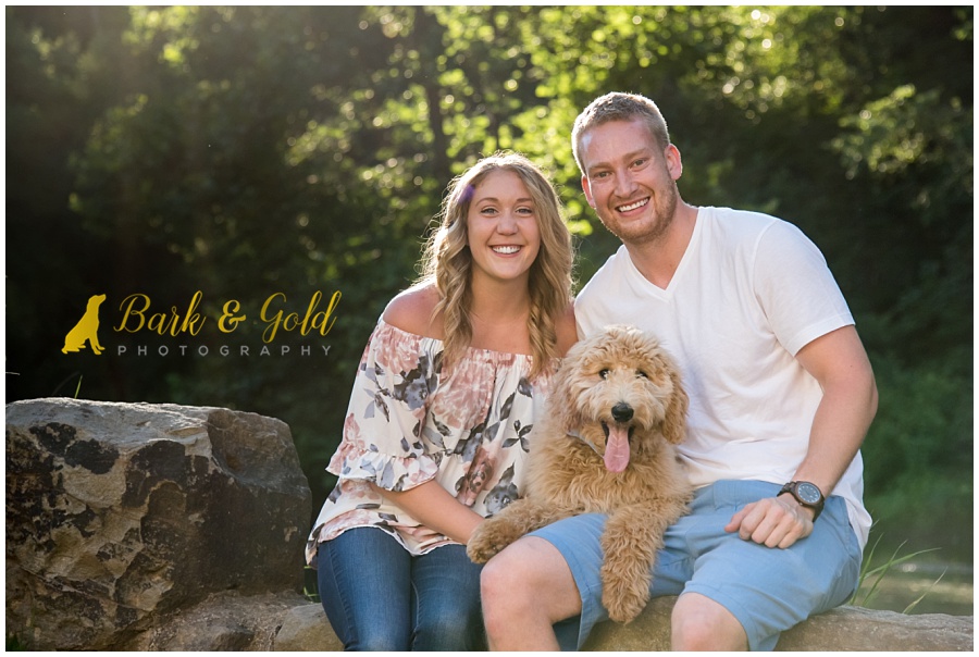 goldendoodle puppy posing with family at Brady's Run Park in Beaver County