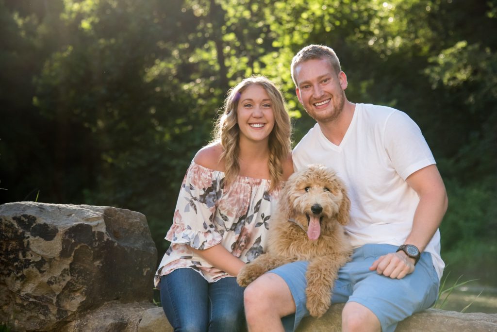 young couple and goldendoodle puppy at Brady's Run Park in Beaver Falls