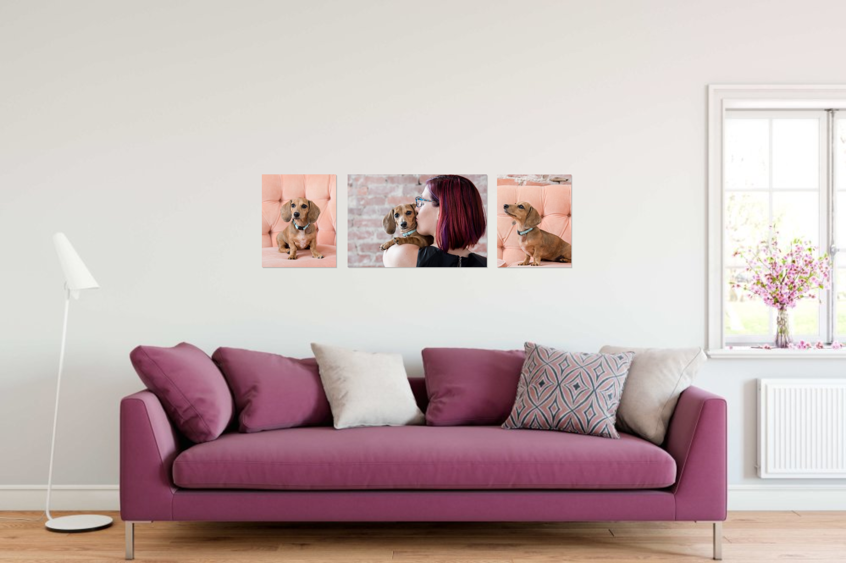 gallery-wrapped canvases grouping above deep pink sofa
