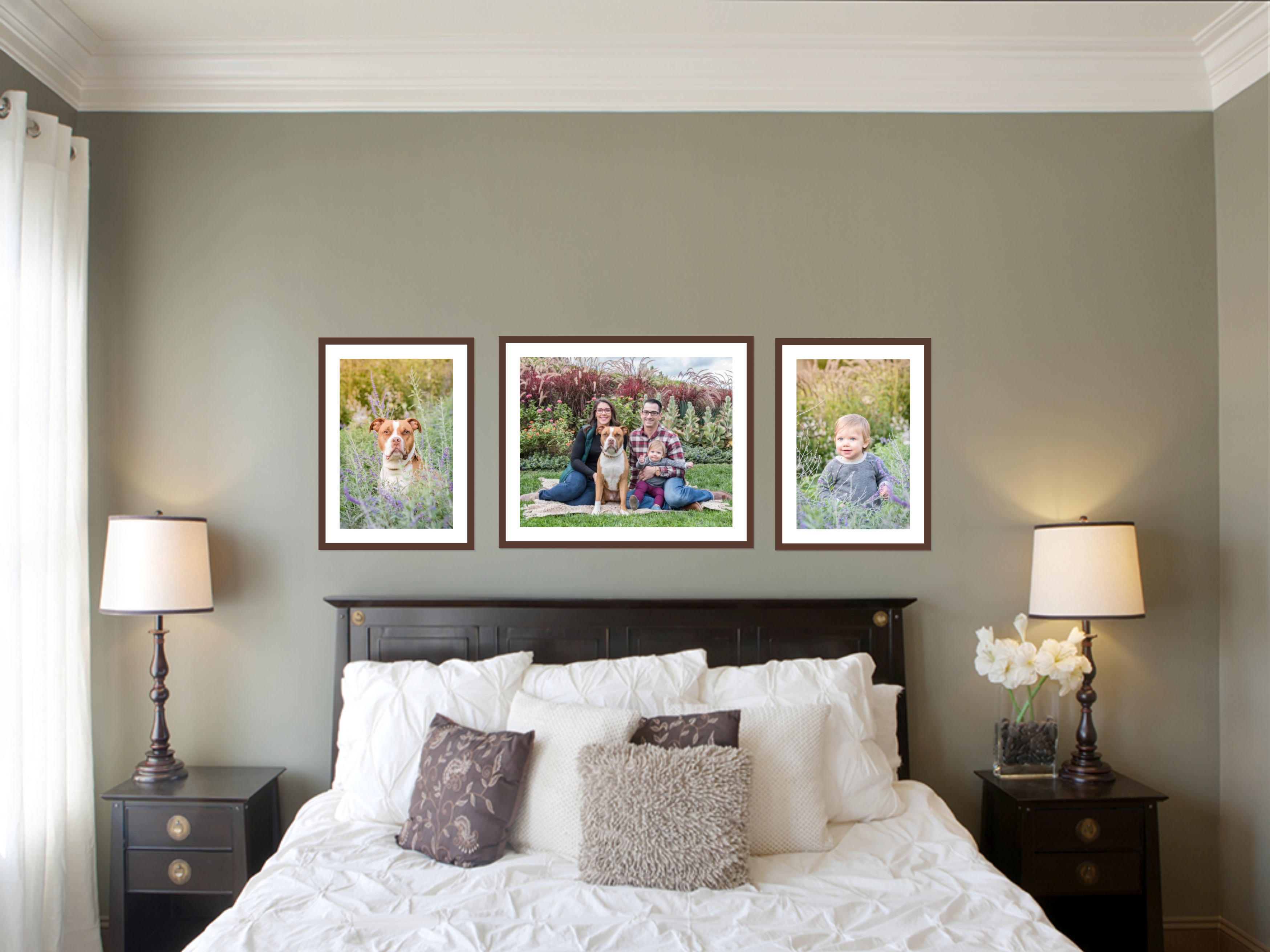 bedroom with framed wall portraits of pit bull and family