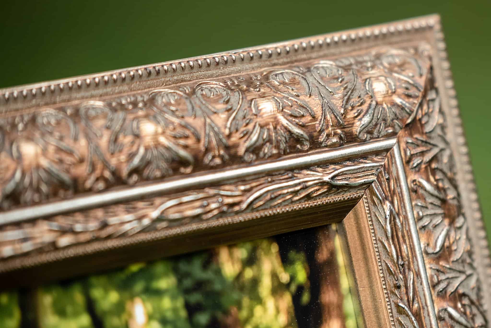 elaborate gold frame corner from a traditional framed print