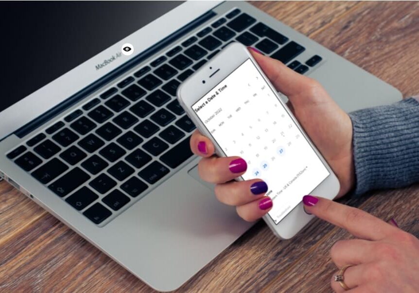 female with purple fingernails scheduling a call via Calendly on an iPhone